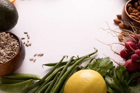 Directly above view of copy space by various fresh vegetables and fruits on white background. unaltered, food, healthy eating, organic concept.の写真素材
