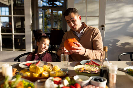 Image of caucasian father and daughter preparing outdoor dinner. Family and spending quality time together concept.の写真素材