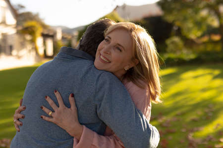 Image of happy senior caucasian couple embracing in garden. Family and spending quality time...