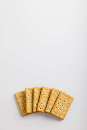 Overhead view of crackers on white background with copy space. unaltered, food and studio shot.