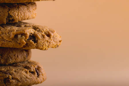 Close-up of stacked cookies against brown background with copy space. unaltered, food, baked, studio shot and snack.の写真素材