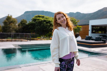 Portrait of happy caucasian woman smiling in garden. Health, celebration, friendship, inclusivity...