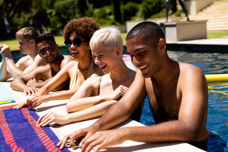 Happy diverse group of friends having pool party in garden. Lifestyle, friendship, party and summer.の写真素材