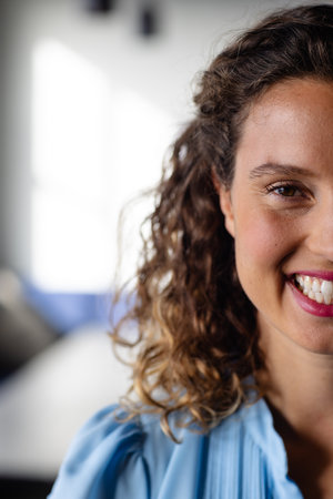 Half portrait of happy caucasian casual businesswoman in office. Casual office, business, professional and work, unaltered.の写真素材