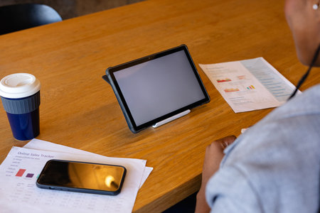 Plus size african american casual businesswoman making video call using tablet, copy space in...