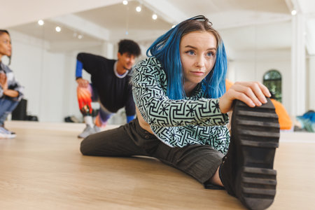 Image of caucasian female hip hop dancer practicing at dance studio. Dance, rhythm, movement and...