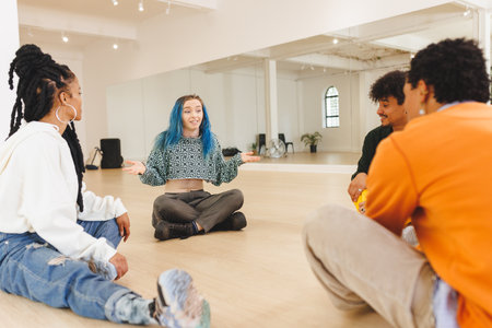 Image of diverse female and male hip hop dancers during training in dance club. Dance, rhythm, movement and training concept.の写真素材