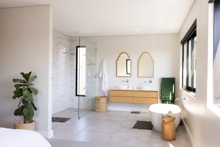 Modern bathroom with double sinks, glass shower, and freestanding bathtub, copy space. Interior design, luxury, minimalism, home decor, architecture, contemporary, unalteredの写真素材