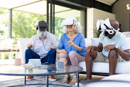 At home, Diverse group of friends using VR headsets, enjoying virtual reality experience....