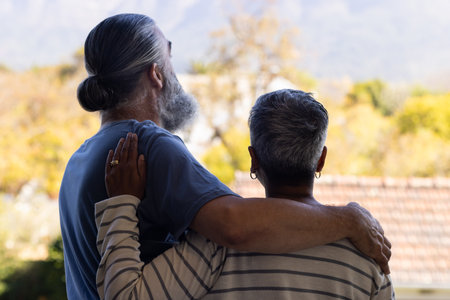 Senior couple embracing and enjoying outdoor view together, showing affection. Romance, retirement, love, elderly, togetherness, bondingの写真素材