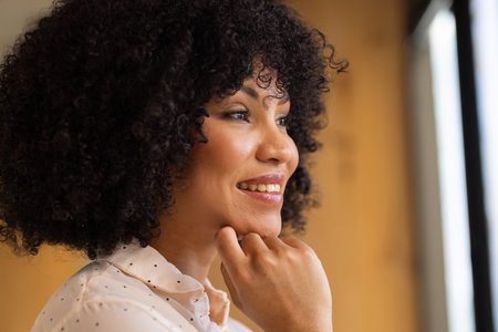 Looking out window, smiling businesswoman thinking about future opportunities. success,...