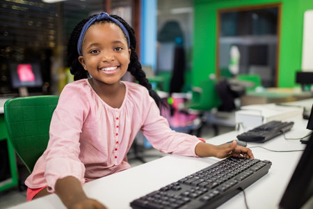 Children looking their computer at school