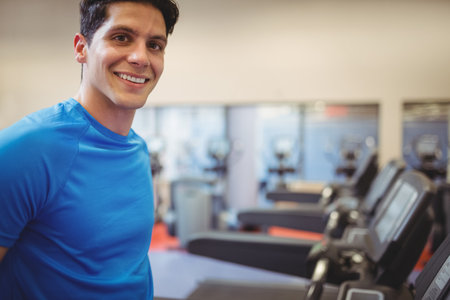 Fit people using the treadmill at the gym