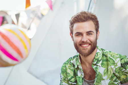 Happy hipsters smiling at camera at a music festivalの写真素材