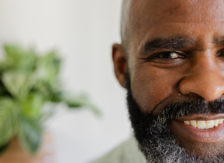 Smiling African American man with beard enjoying moment at wedding celebration. happiness, formal, event, gathering, elegant, attireの写真素材