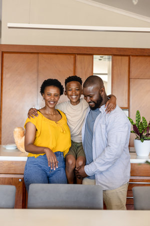 Happy family spending quality time together in modern kitchen at home. lifestyle, bonding,...
