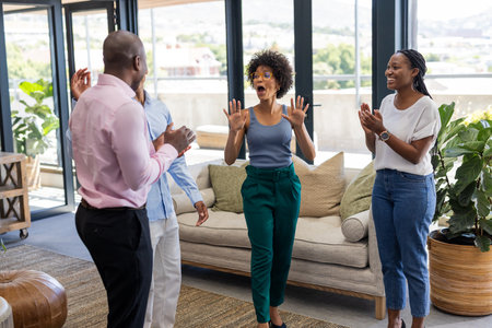 Celebrating success, colleagues expressing excitement and joy together. Teamwork, collaboration, happiness, achievement, diversityの写真素材