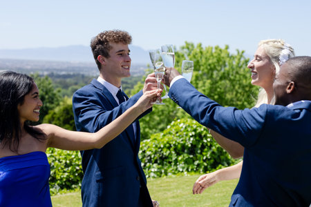 Happy senior diverse female friends eating birthday cake at birthday partyの写真素材