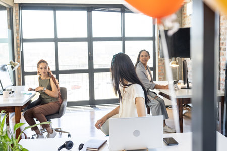 Sharing ideas, colleagues in modern office celebrating successful project together. Teamwork, collaboration, brainstorming, innovation, achievement, businessの写真素材
