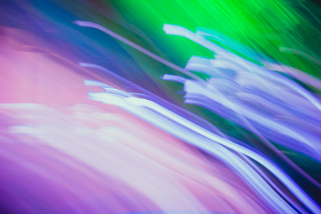 Streaks of light colored. Glowing abstract lines. Green, blue, purple and pink colors.の写真素材