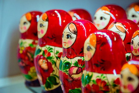 Many red babushkas arranged in a row.の写真素材