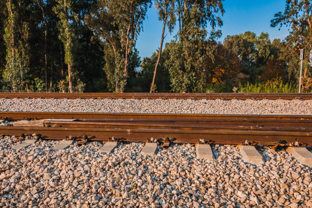 Railroad track in a rural area in the afternoon