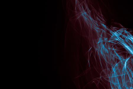 Light painted glowing abstract blue and red curved lines on a black backgroundの写真素材