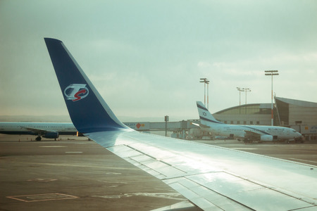 Tel Aviv, Israel - Sep 15, 2015: Travel Service airline commercial plane wing and El Al airline commercial plane near terminal 3 at Ben Gurion international airport.のeditorial素材