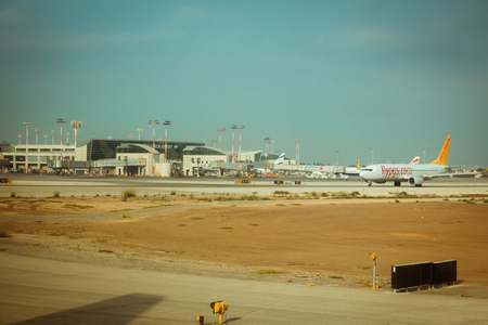 Tel Aviv, Israel - Sep 15, 2015: Flypgs airline commercial plane on the runway and terminal 3 at Ben Gurion International Airport.のeditorial素材