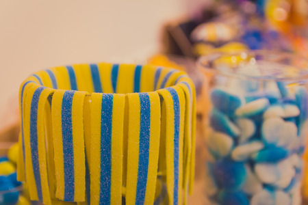 Close up of bowl with colorful sweet tasty gummy candy at children birthday party.の写真素材