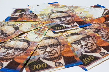 Stack of Israeli money bills of 100 shekel.の写真素材