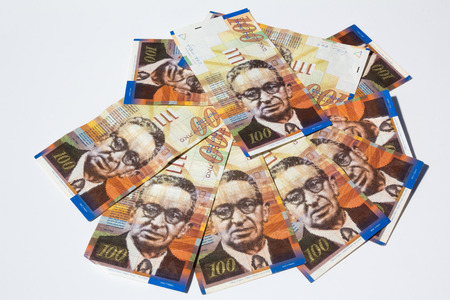 Stack of Israeli money bills of 100 shekel - top view.の写真素材