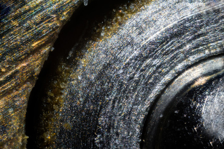 Metal key surface under the microscope. Closeup macro photography.