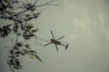 Israeli military UH-60 Black Hawk helicopter flying in the sky. Low angle view.のeditorial素材