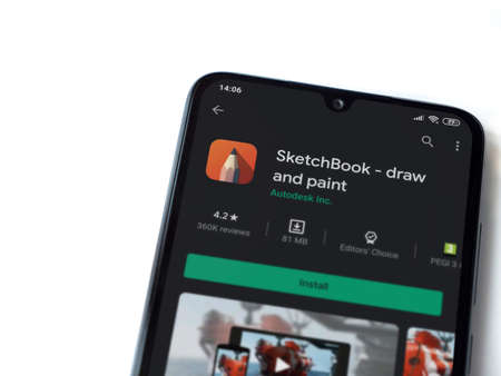 Lod, Israel - July 8, 2020: Autodesk SketchBook - draw and paintÂ app play store page on the display of a black mobile smartphone isolated on white background. Top view flat lay with copy space.のeditorial素材