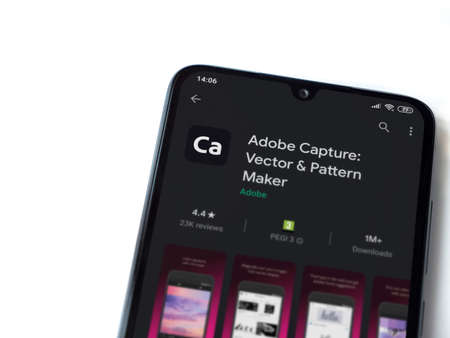 Lod, Israel - July 8, 2020: Adobe Capture - Vector & Pattern Maker app play store page on the display of a black mobile smartphone isolated on white background. Top view flat lay with copy space.のeditorial素材