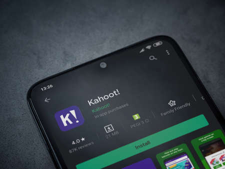 Lod, Israel - July 8, 2020: Kahoot! app play store page on the display of a black mobile smartphone on a dark marble stone background. Top view flat lay with copy space.のeditorial素材