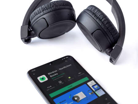 Lod, Israel - July 8, 2020: Black mobile smartphone with Blinkist app play store page and wireless...