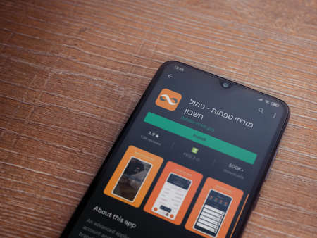 Lod, Israel - July 8, 2020: Bank Mizrahi Tefahot app play store page on the display of a black...