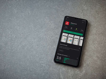 Lod, Israel - July 8, 2020: Roborock app play store page on the display of a black mobile smartphone on ceramic stone background. Top view flat lay with copy space.のeditorial素材