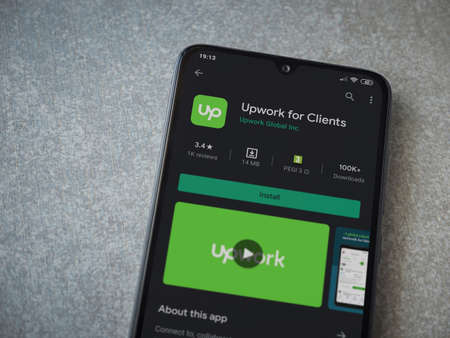 Lod, Israel - July 8, 2020: Upwork for Clients app play store page on the display of a black mobile...