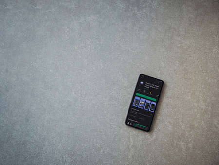 Lod, Israel - July 8, 2020: Discord app play store page on the display of a black mobile smartphone on ceramic stone background. Top view flat lay with copy space.のeditorial素材