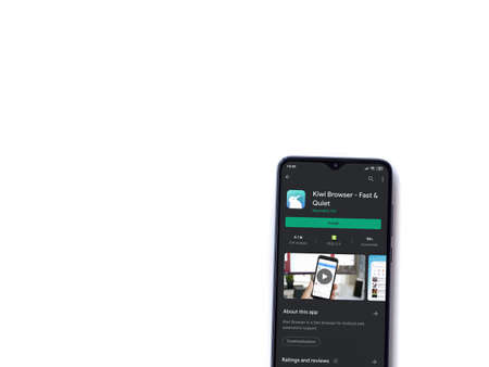 Lod, Israel - July 8, 2020: Kiwi Browser app play store page on the display of a black mobile smartphone isolated on white background. Top view flat lay with copy space.のeditorial素材