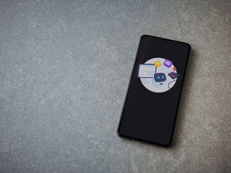 Lod, Israel - July 8, 2020: Mimo - Learning coding app launch screen with logo on the display of a black mobile smartphone on ceramic stone background. Top view flat lay with copy space.のeditorial素材