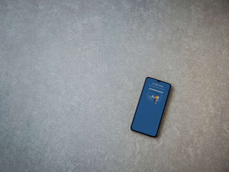 Lod, Israel - July 8, 2020: SoloLearn - Learning coding app launch screen with logo on the display of a black mobile smartphone on ceramic stone background. Top view flat lay with copy space.のeditorial素材