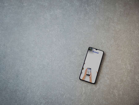 Lod, Israel - July 8, 2020: Quizlet - Language learning app launch screen with logo on the display of a black mobile smartphone on ceramic stone background. Top view flat lay with copy space.のeditorial素材