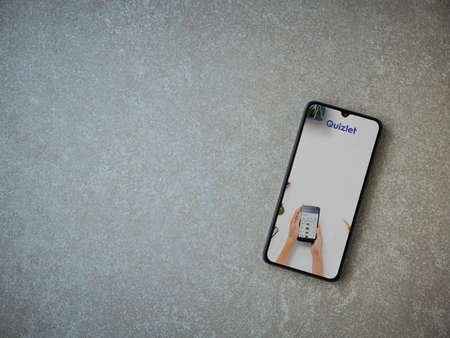 Lod, Israel - July 8, 2020: Quizlet - Language learning app launch screen with logo on the display of a black mobile smartphone on ceramic stone background. Top view flat lay with copy space.のeditorial素材