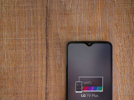 Lod, Israel - July 8, 2020: LG TV Plus app launch screen with logo on the display of a black mobile...