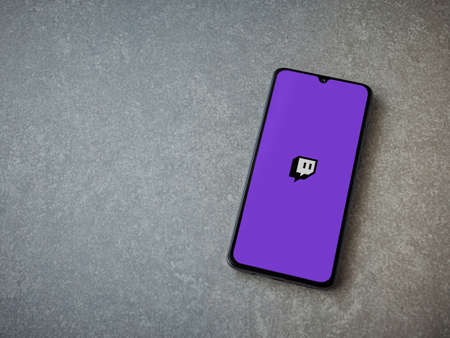 Lod, Israel - July 8, 2020: Twitch app launch screen with logo on the display of a black mobile...