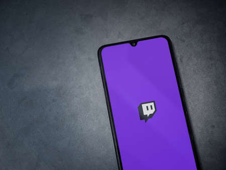 Lod, Israel - July 8, 2020: Twitch app launch screen with logo on the display of a black mobile...